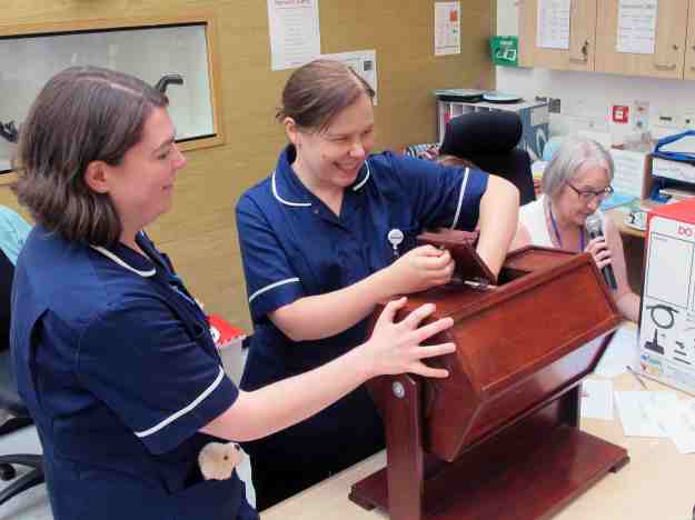 Hospital staff draw the raffle.