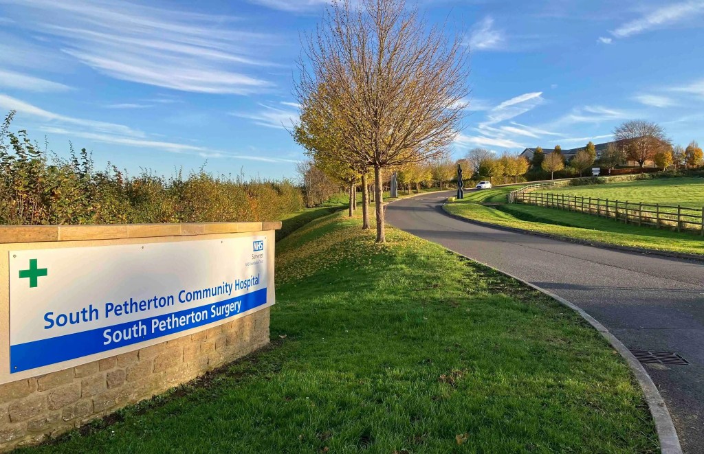 sign of South Petherton hospital at the end of a sweeping road that leads to the hospital